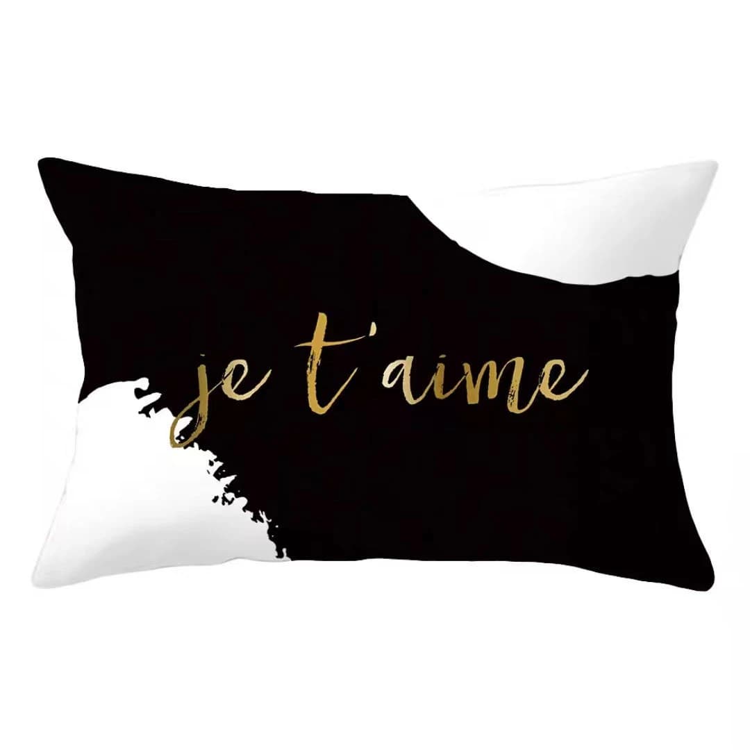 Travesseiro decorativo preto e branco com padrões florais e frases variadas