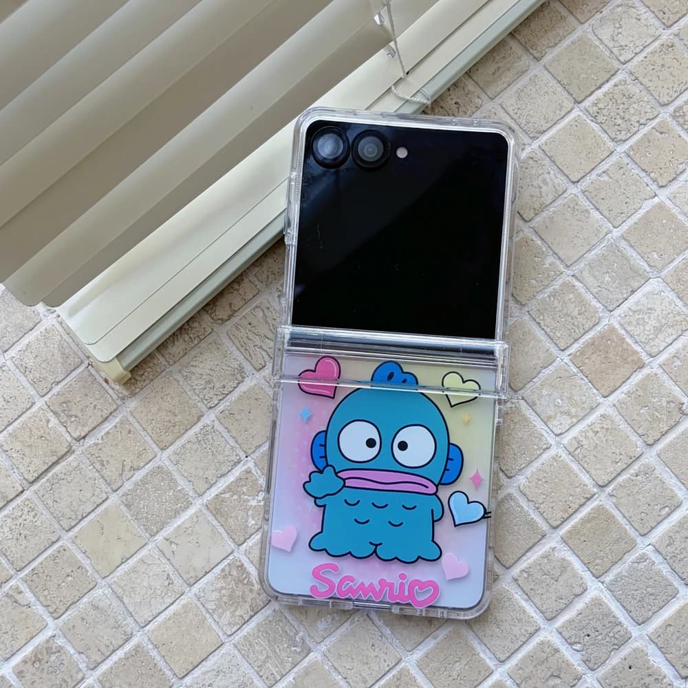 Capa TPU transparente Sanrio Hangyodon para Samsung Galaxy Z Flip com design colorido e logo Sanrio