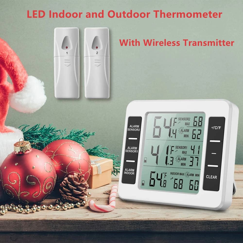Termômetro digital LCD branco com sensores sem fio e fundo verde com decorações de Natal