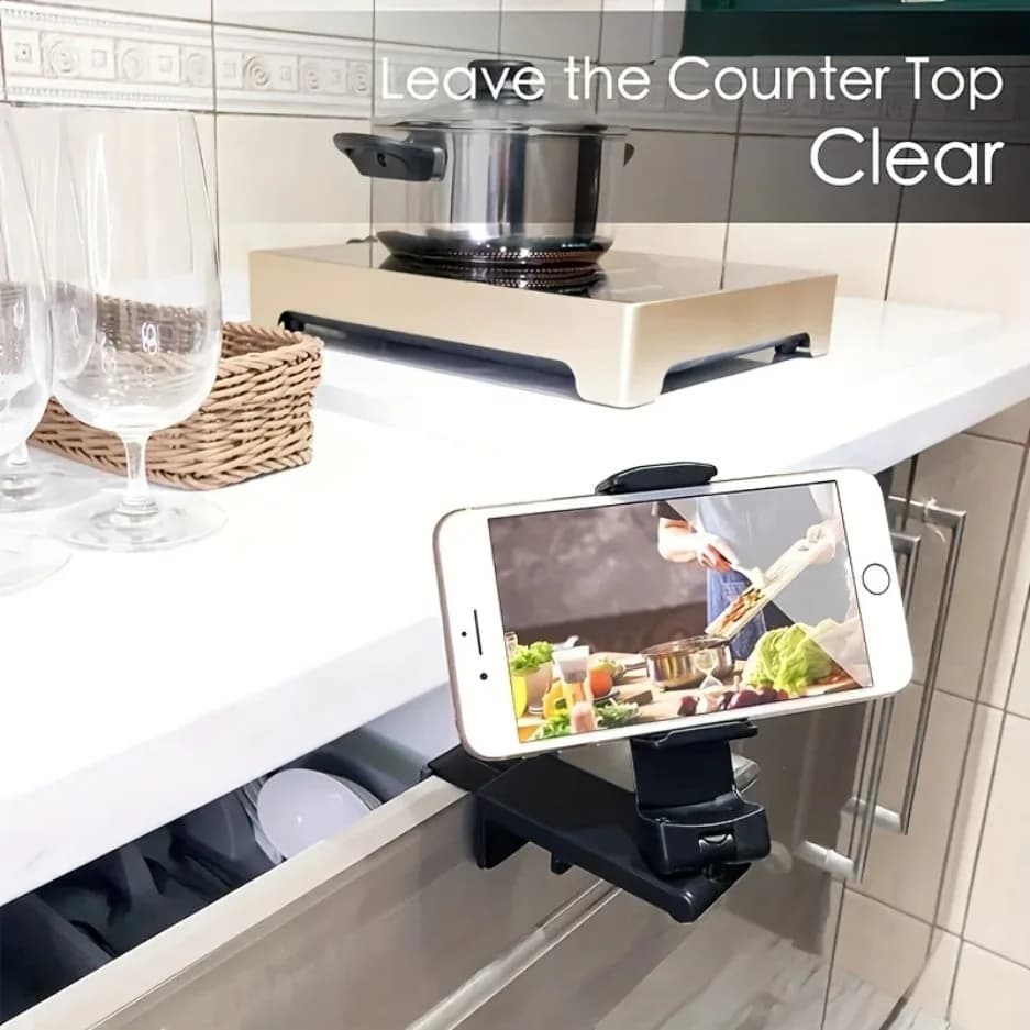 Suporte universal para celular preto fixado em gaveta de cozinha com celular exibindo receita