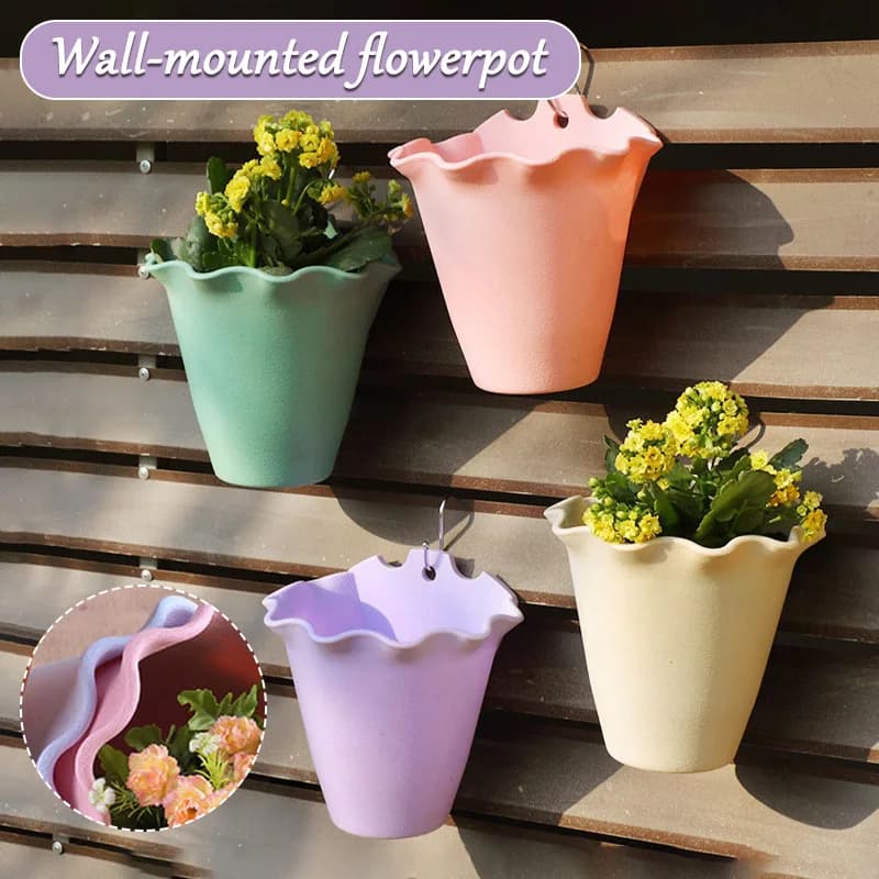 Vasos de flores de plástico para parede em cores rosa, magenta, turquesa e amarelo claro com plantas amarelas