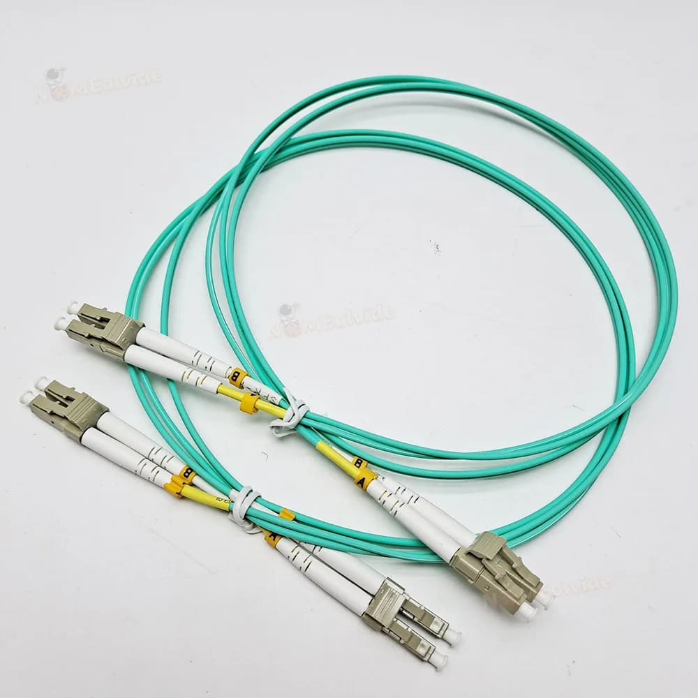 Cabos de fibra óptica LC a LC UPC, multimodo, ciano e amarelo, com texto 'LC to LC upc Duplex Cable OM3' e 'Best Price' em fundo branco.