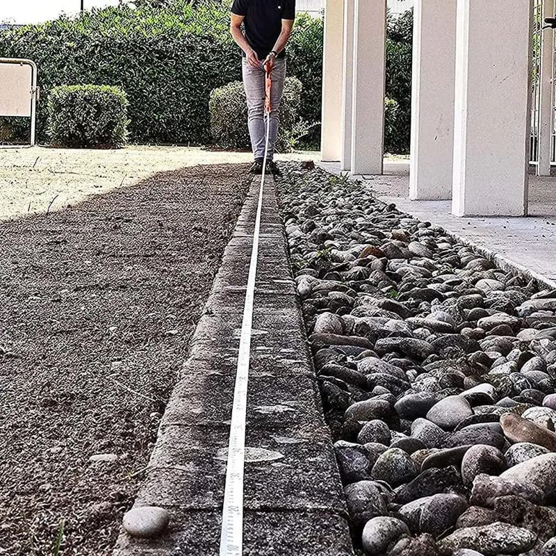 Fita métrica de 20m com carretel de fibra de vidro, cor laranja, manivela de mão, fundo branco