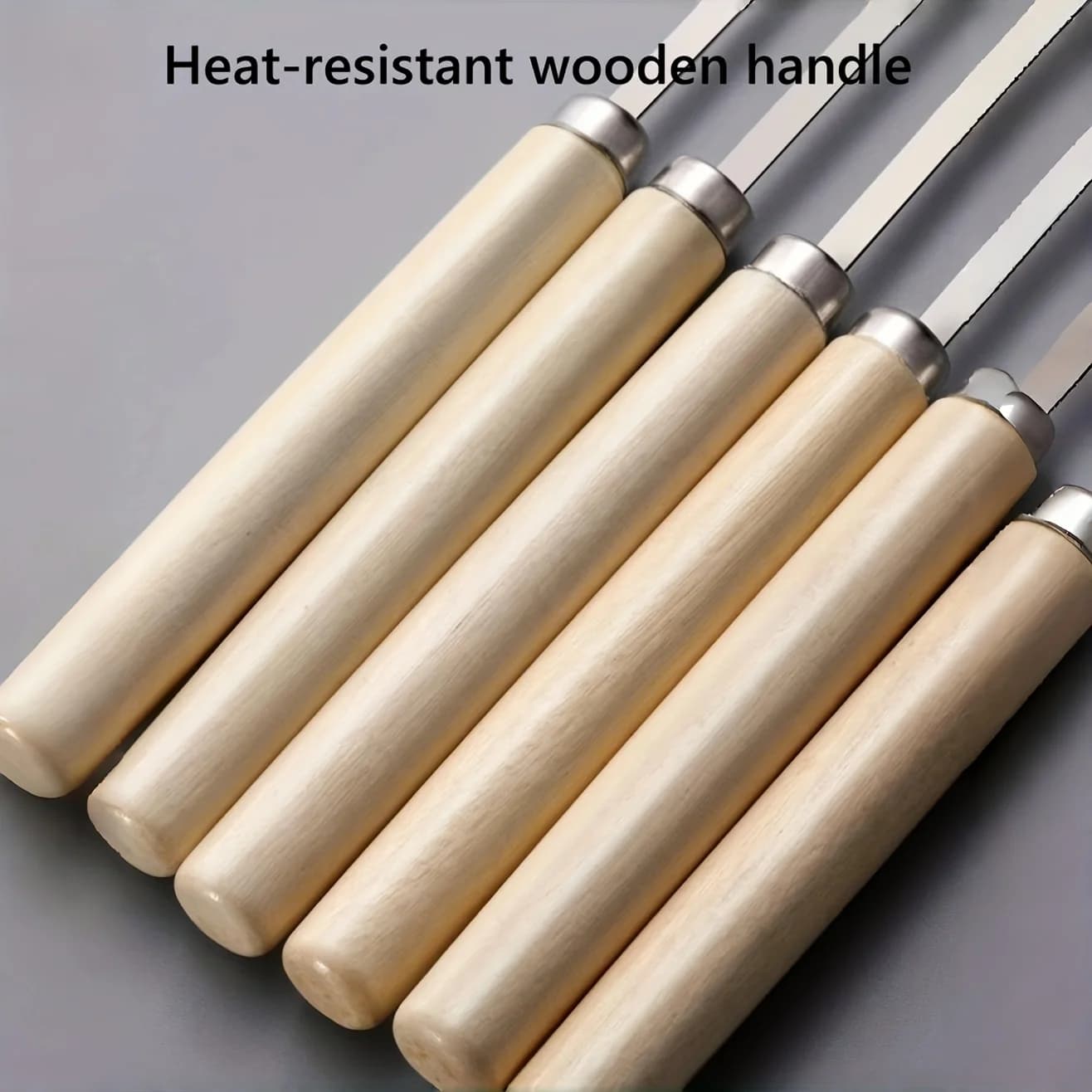 Cabos de madeira natural resistentes ao calor dos espetos para churrasco Jácotei em aço inox