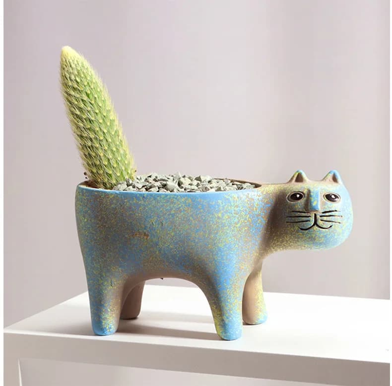 Vaso decorativo para plantas em cerâmica azul formato gato com suculenta pequena