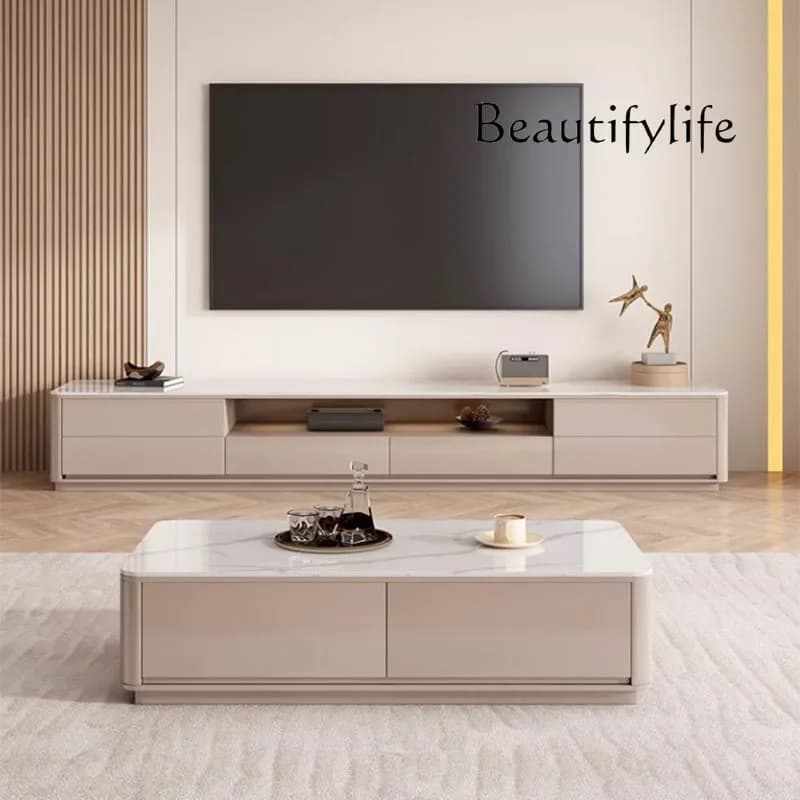 Mesa de centro moderna de cor bege, estilo minimalista, com superfície de mármore e laterais de madeira.