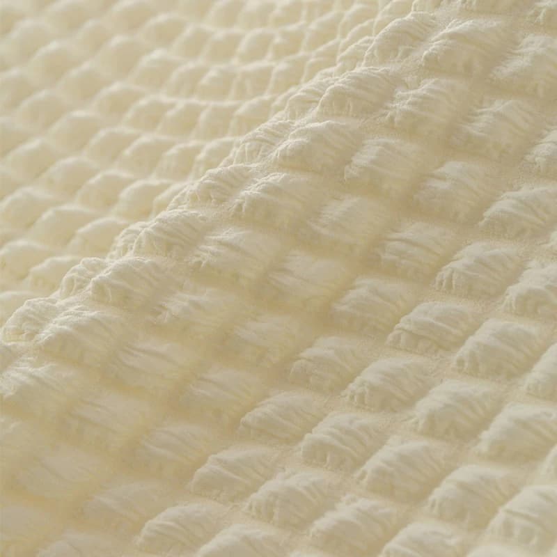 Close em tecido elástico waffle xadrez macio branco com textura quadriculada detalhada