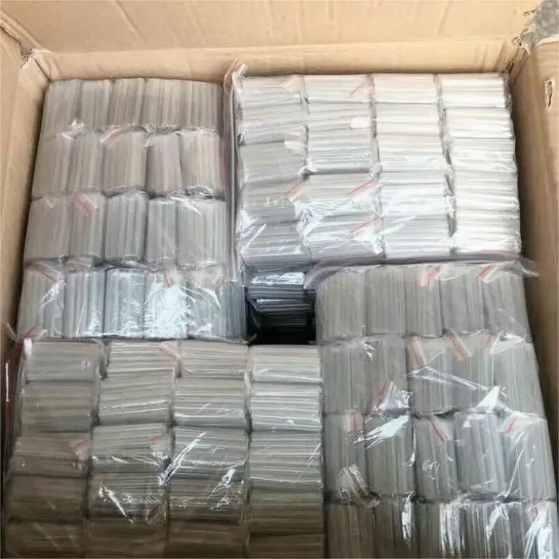 Caixa contendo vários pacotes plásticos com mangas de proteção transparentes para emenda de fibra óptica 1,2mm x 40mm