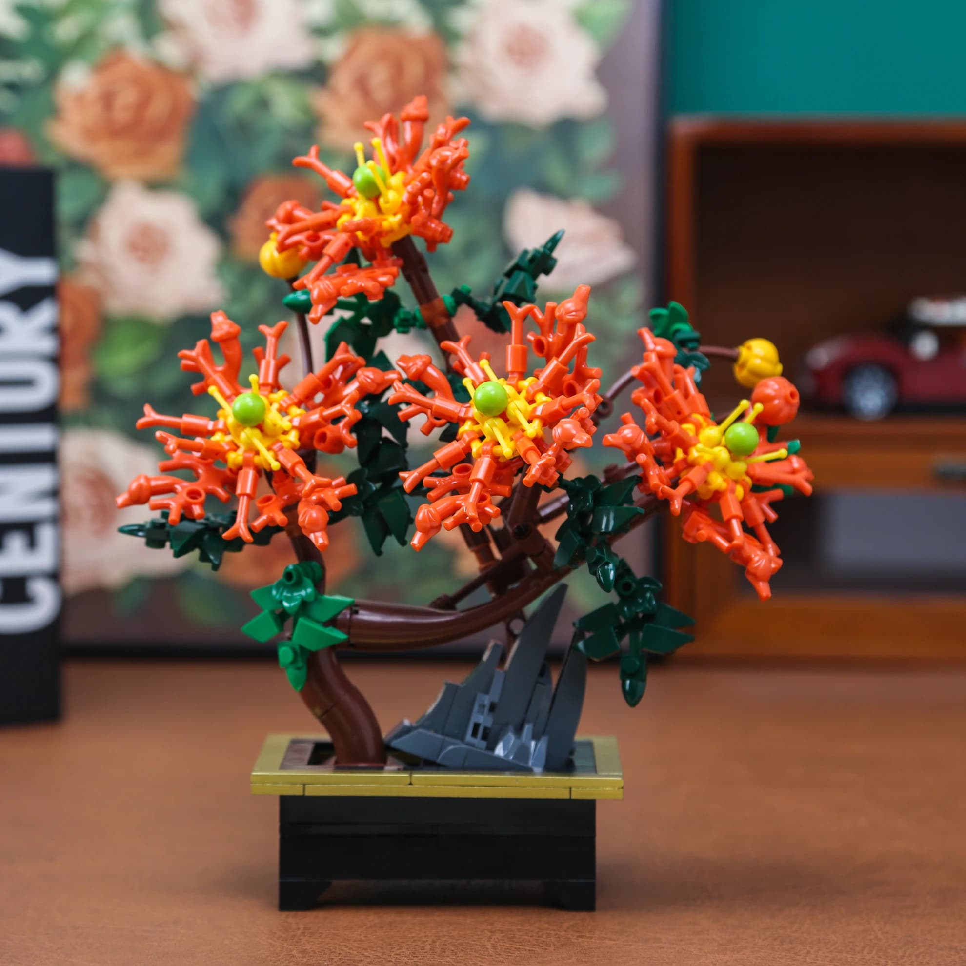 Brinquedo de montar bonsai crisântemo com flores laranja e base preta decorativa infantil