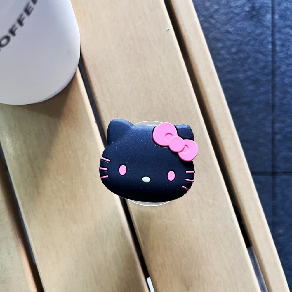 Suporte de dedo para celular Sanrio Hello Kitty preto com laço rosa para smartphone