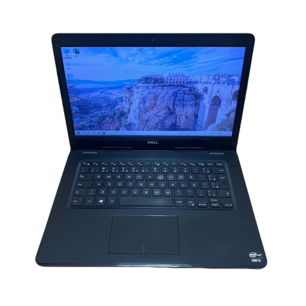 Notebook Dell aberto com teclado e tela preta exibindo paisagem