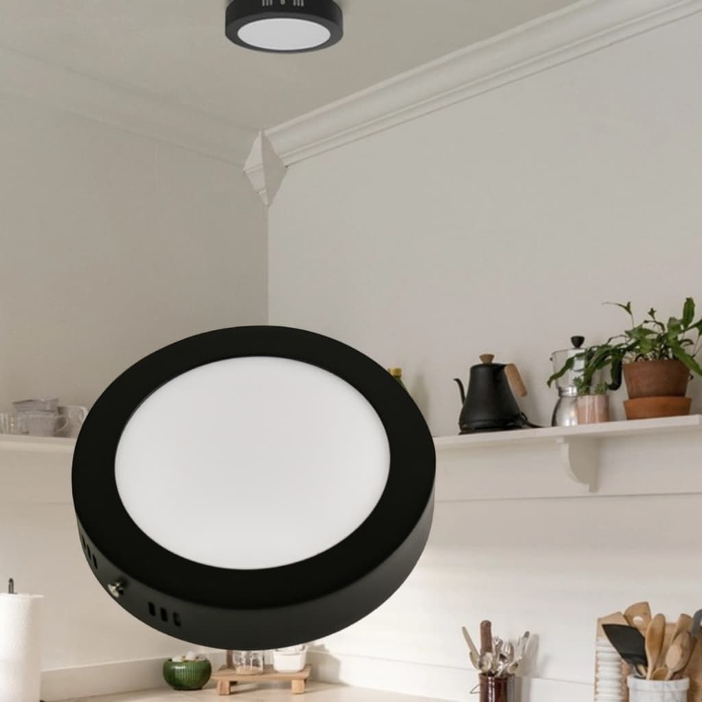 Painel LED redondo preto e branco iluminando uma área de cozinha