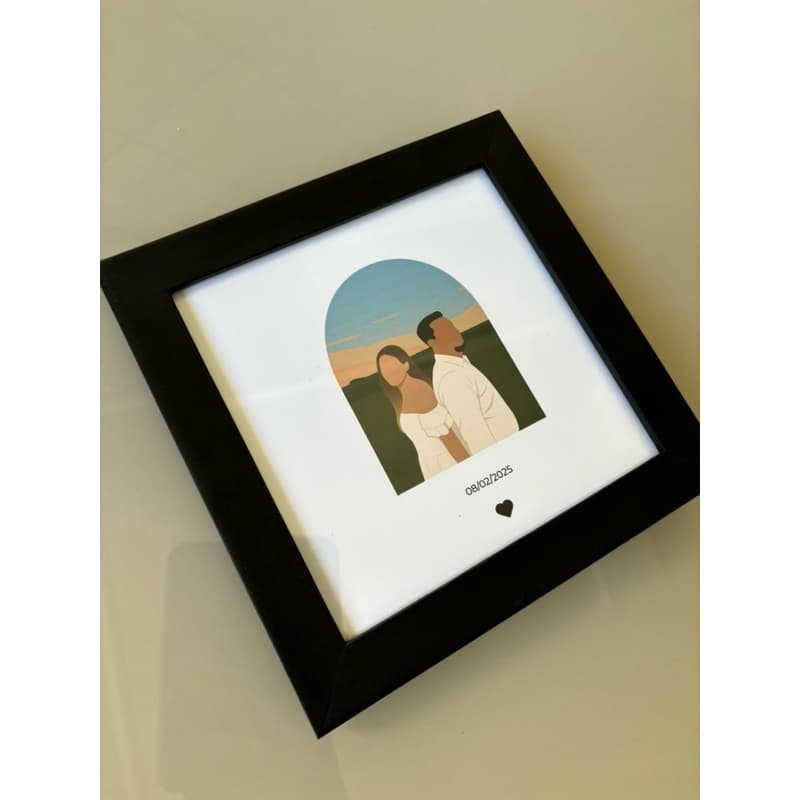 Quadro decorativo minimalista com moldura preta de um casal em um cenário ao ar livre