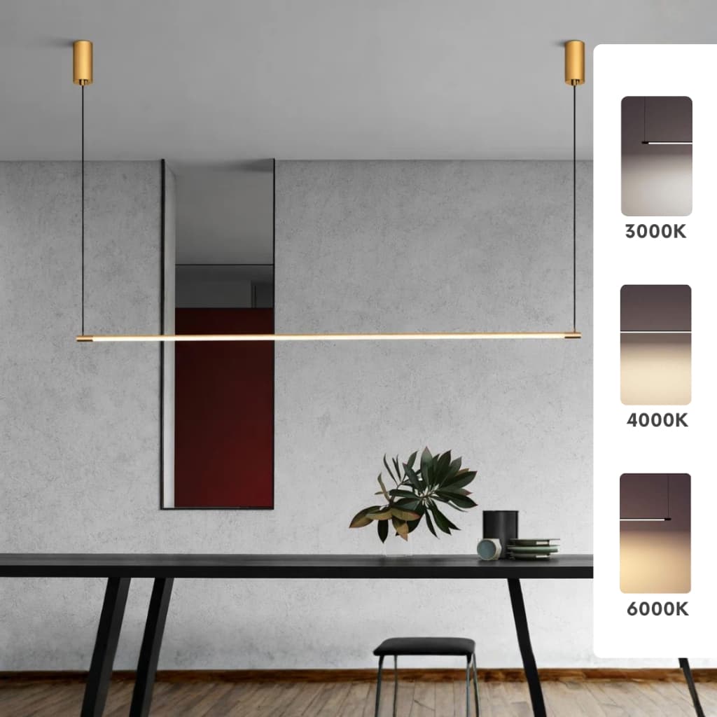 Luminária pendente linear dourada com LED de três cores em um ambiente moderno