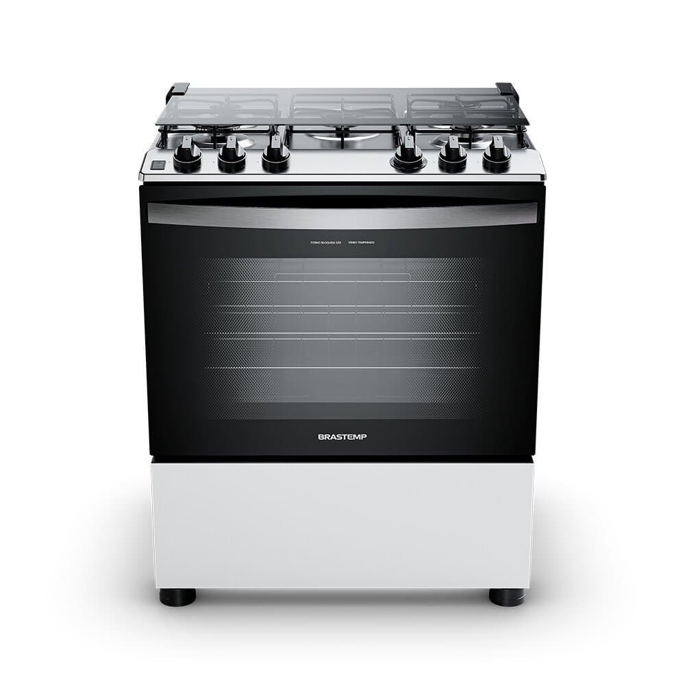 Fogão Brastemp 5 bocas com botões removíveis e aro protetor, fundo branco, porta do forno fechada, moldura em aço inoxidável, marca Brastemp visível.