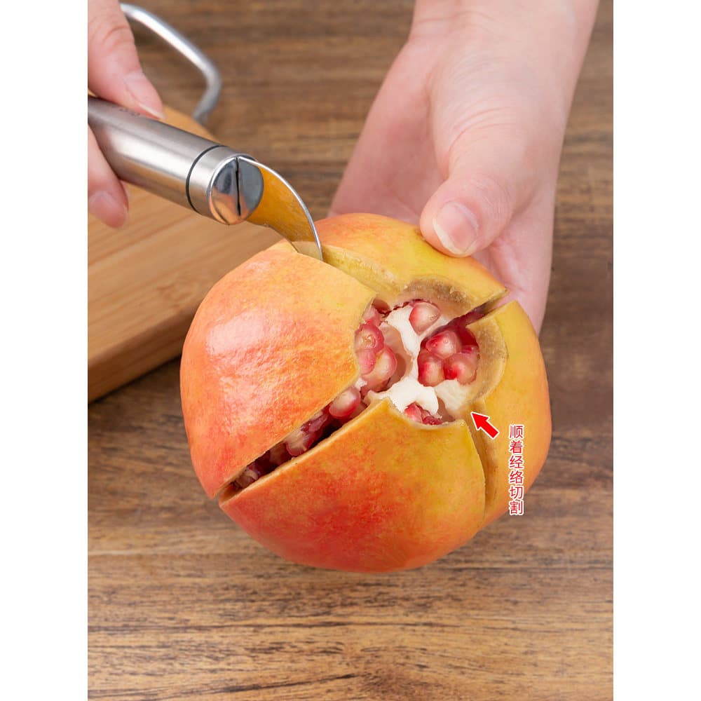 Faca de romã dupla cabeça 304 aço inoxidável cortando uma romã laranja