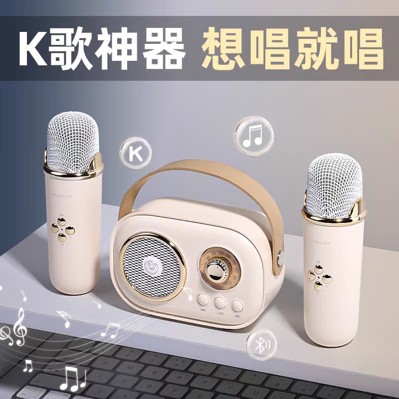 Conjunto de áudio retro Bluetooth com microfones integrados, microfones rosa pálido e alto-falante estilizado, sobre um teclado de computador.