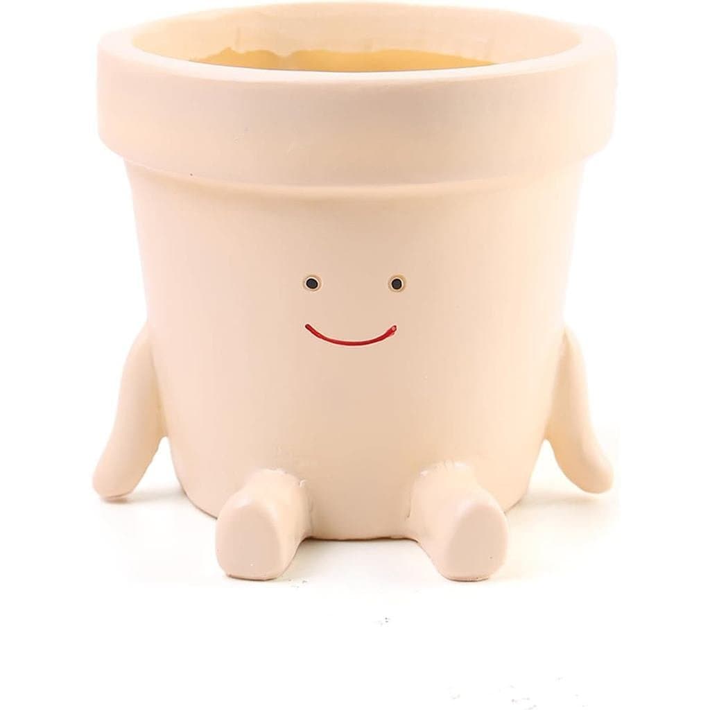 Vaso decorativo de plantas com rosto sorridente em pés arredondados, branco com detalhes rosados.