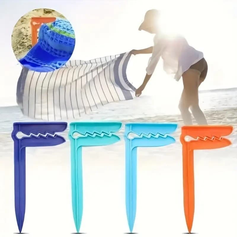 Presilhas de plástico coloridas para toalha de praia na areia