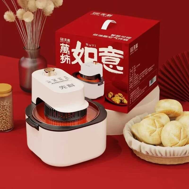 Fritadeira de ar branca com controles digitais e cesta para frituras, em uma mesa vermelha com caixa e jar de grãos.