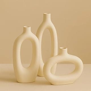 Conjunto de vasos decorativos brancos em forma de ovo, fundo bege