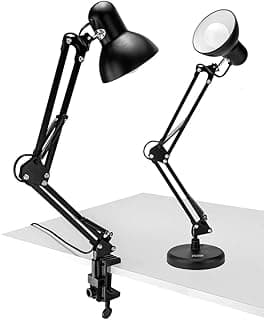 Duas luminárias de mesa articuladas em metal preto sobre superfície branca