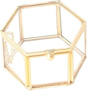 Caixa hexagonal de vidro transparente com bordas douradas metálicas e botão dourado