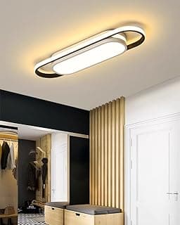 Luminária de teto LED oval, design moderno em preto e branco, iluminando área de entrada.