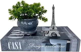 Conjunto decorativo com livro caixa cinza, vaso cinza com planta e enfeite da Torre Eiffel prata