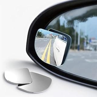Espelho convexo para carros e motos, mostra reflexo da estrada e faixas amarelas.
