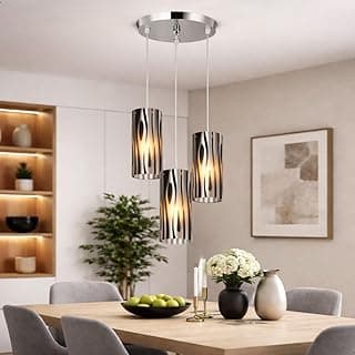 Pendentes de luz com cúpulas de vidro e cabo ajustável em um ambiente de jantar