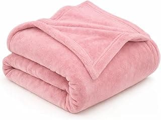 Manta de microfibra fleece rosa-claro, macia e leve, ideal para cama e sofá.