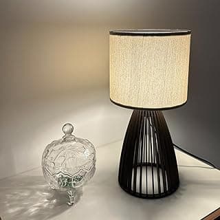 Luminária de mesa preta com cúpula clara e recipiente de vidro transparente