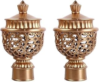 Duas tampas de varão de cortina douradas retrô com design vazado.