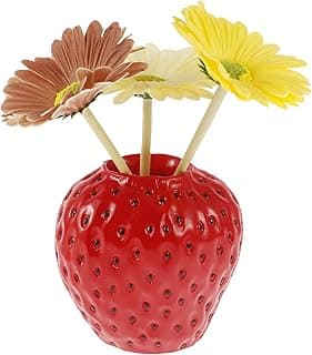 Vaso decorativo em forma de morango vermelho com flores de girassol