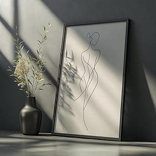 Quadro decorativo minimalista com linhas abstratas formando o contorno de um corpo feminino, em fundo branco, moldura preta.
