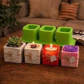 Quatro velas aromáticas em potes de gesso cinza e um pote de suculenta verde em um suporte de silicone verde