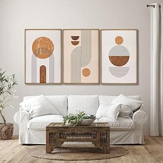 Conjunto de 3 quadros abstratos geométricos, linhas nórdicas, tons terracota e bege, montados na parede.