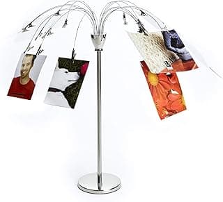 Porta-retrato de mesa com flores de aço inoxidável mostrando várias fotos penduradas