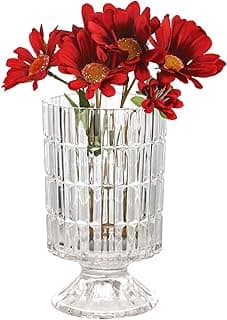 Vaso de vidro transparente com relevo decorativo e flores vermelhas