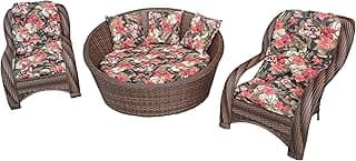 Conjunto de móveis de vime com almofadas florais para área externa