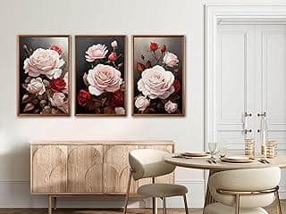Quadros decorativos com flores rosa e vermelhas na sala de jantar