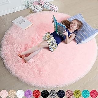 Tapete redondo rosa felpudo para quarto de meninas, ideal para leitura e decoração.