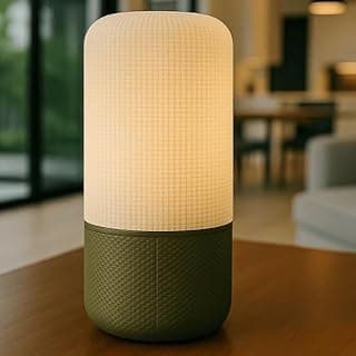 Luminária de mesa cilíndrica verde moderna com luz acesa