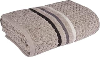 Toalha de banho jacquard com detalhes em preto e cinza, dobrada em ângulo